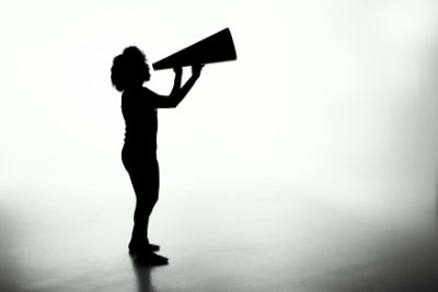 Woman making an announcement with a megaphone